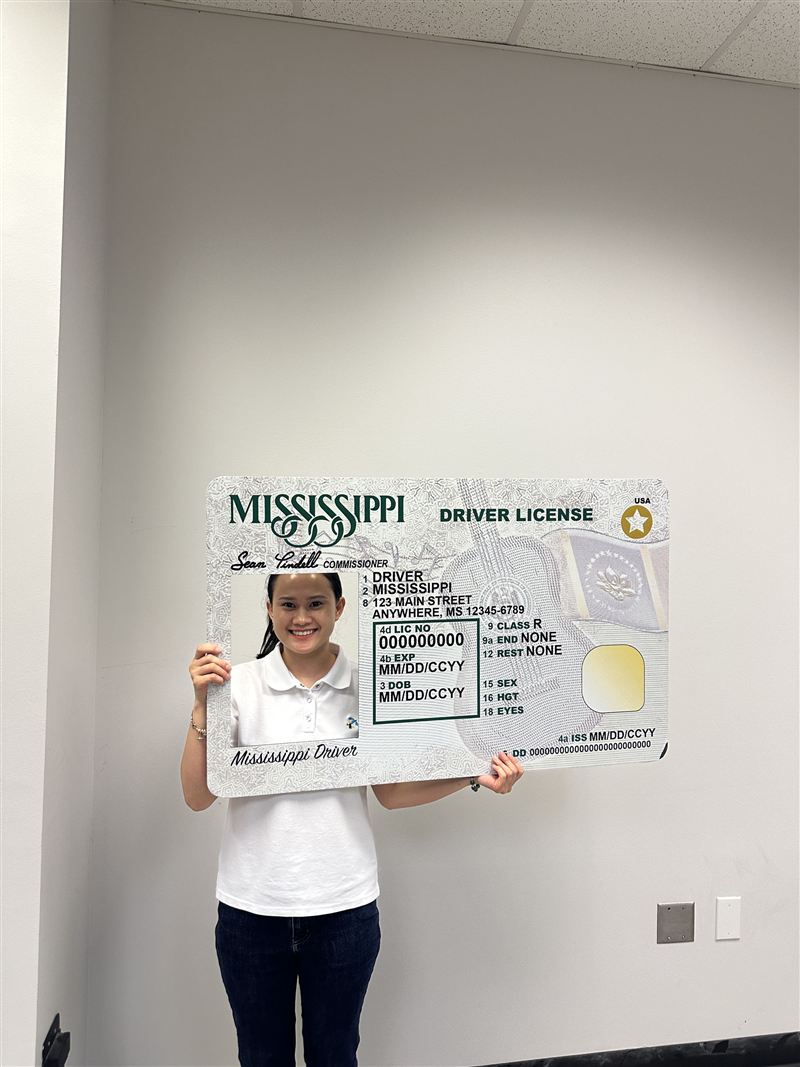 Posing with the Mississippi new-driver photo frame at the Department of Public Safety office