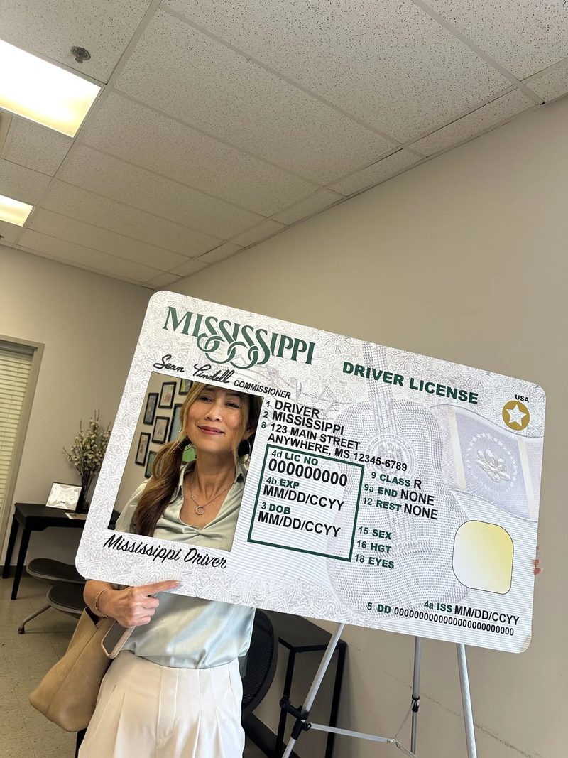 Smiling through the Mississippi new-driver photo frame at the Department of Public Safety office